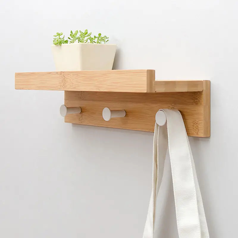 Bamboo multi-functional floating wall shelf with metal hooks displaying rustic home decor and plants. — view 5