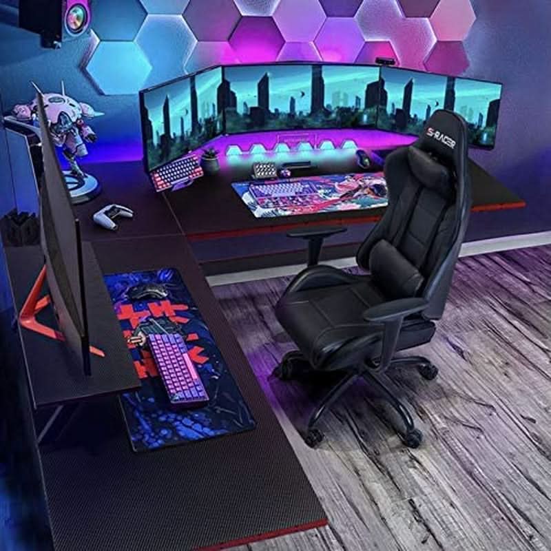 Black L-shaped gaming desk with carbon fiber finish, red accents, monitor riser, and metal Z-shaped legs — view 5