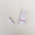 Rose and citrus natural deodorant stick in a zero waste eco friendly cardboard push tube