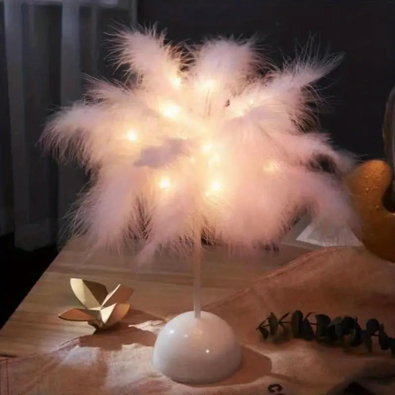 Pink feather touch table lamp emitting a soft cozy glow for bedroom interior decor — view 5