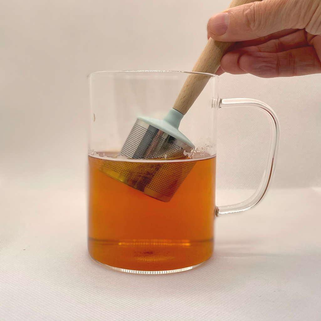 Stainless steel loose leaf tea strainer with beech wood handle and matching wooden drip tray. — view 4
