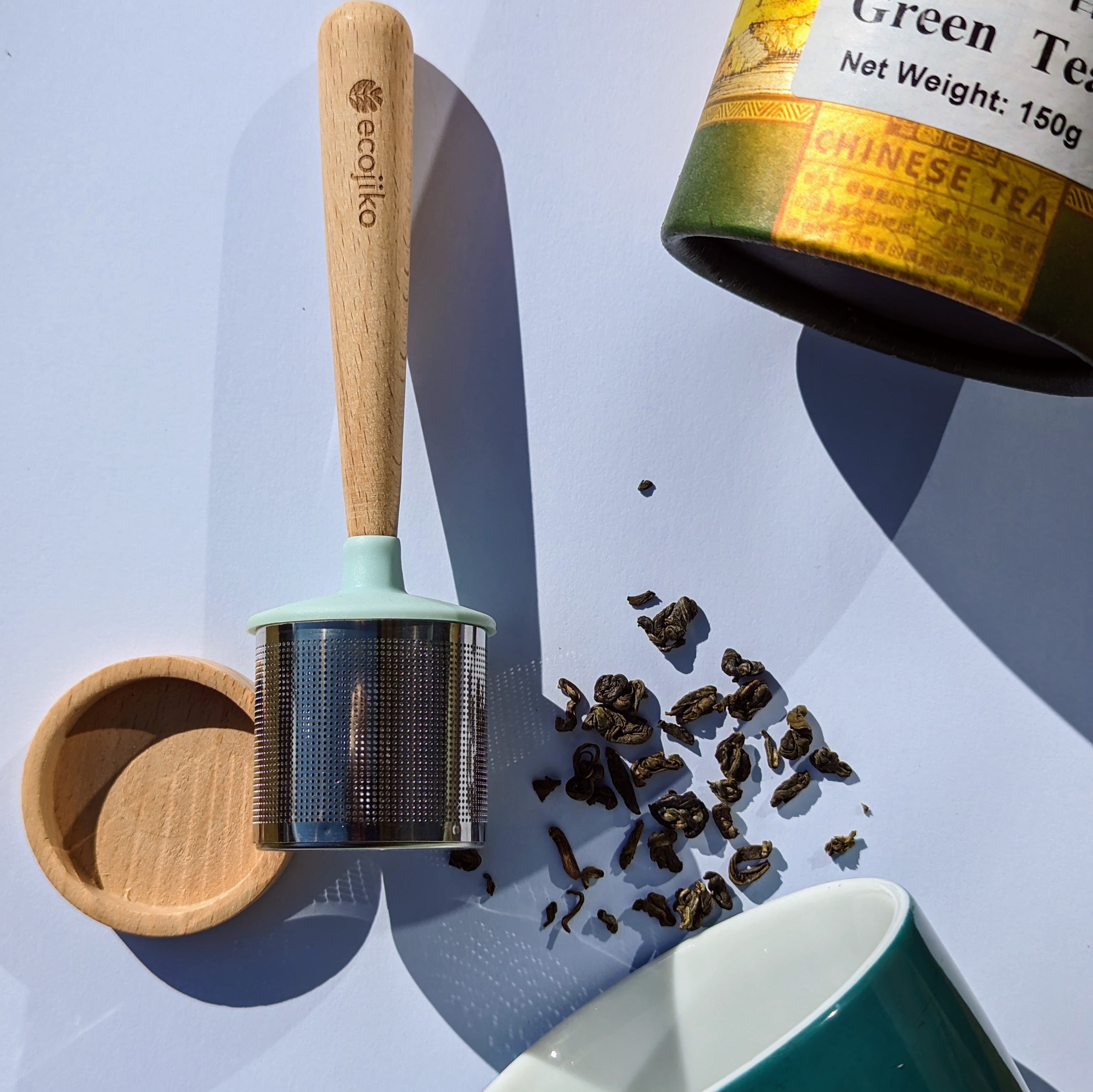 Stainless steel loose leaf tea strainer with beech wood handle and matching wooden drip tray. — view 3
