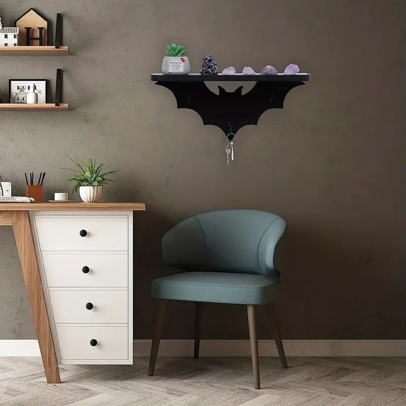 Black wooden bat shaped floating wall shelf featuring three metal key hooks for hanging gothic decor — view 3
