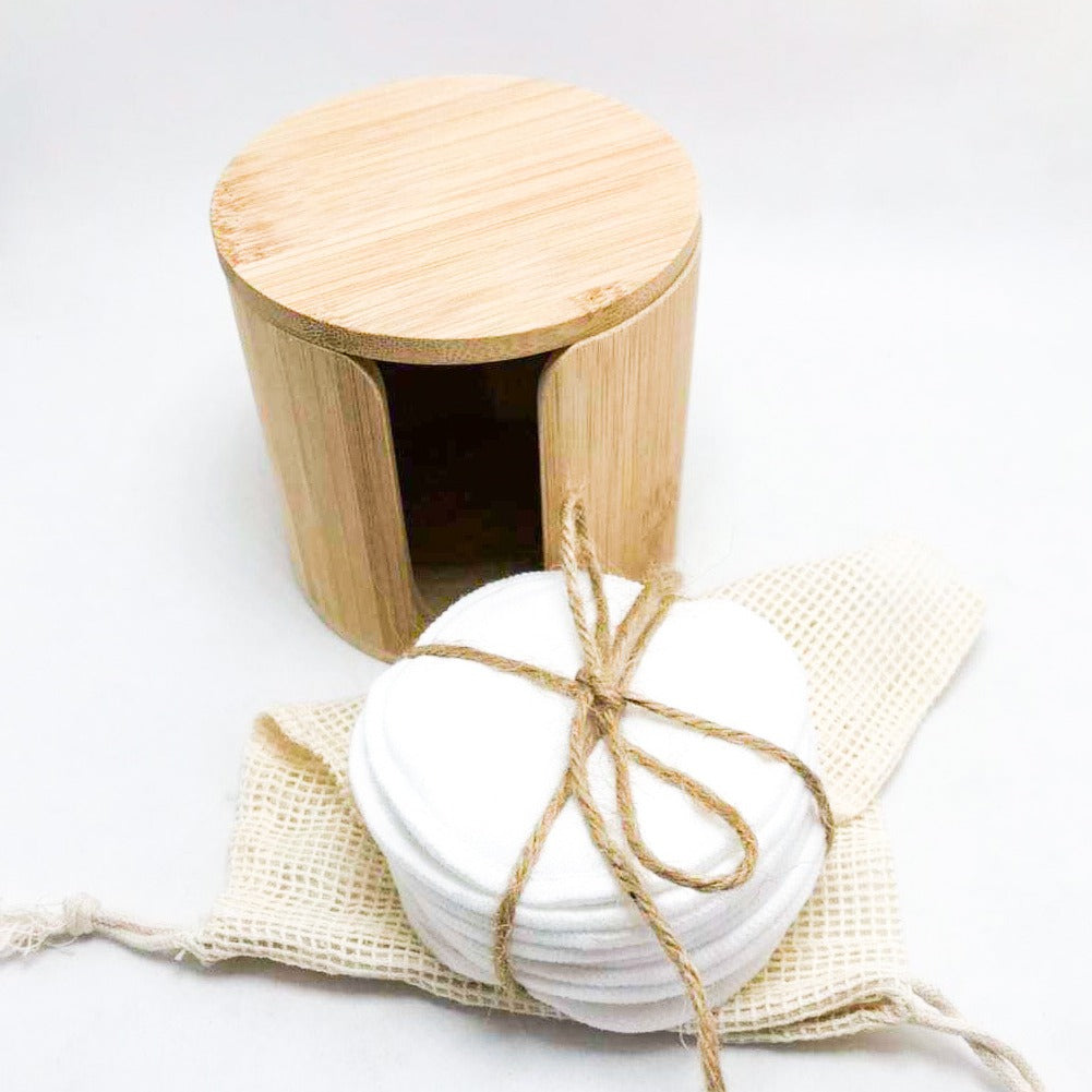 Reusable bamboo cotton makeup remover pads in black and white with mesh laundry bag
