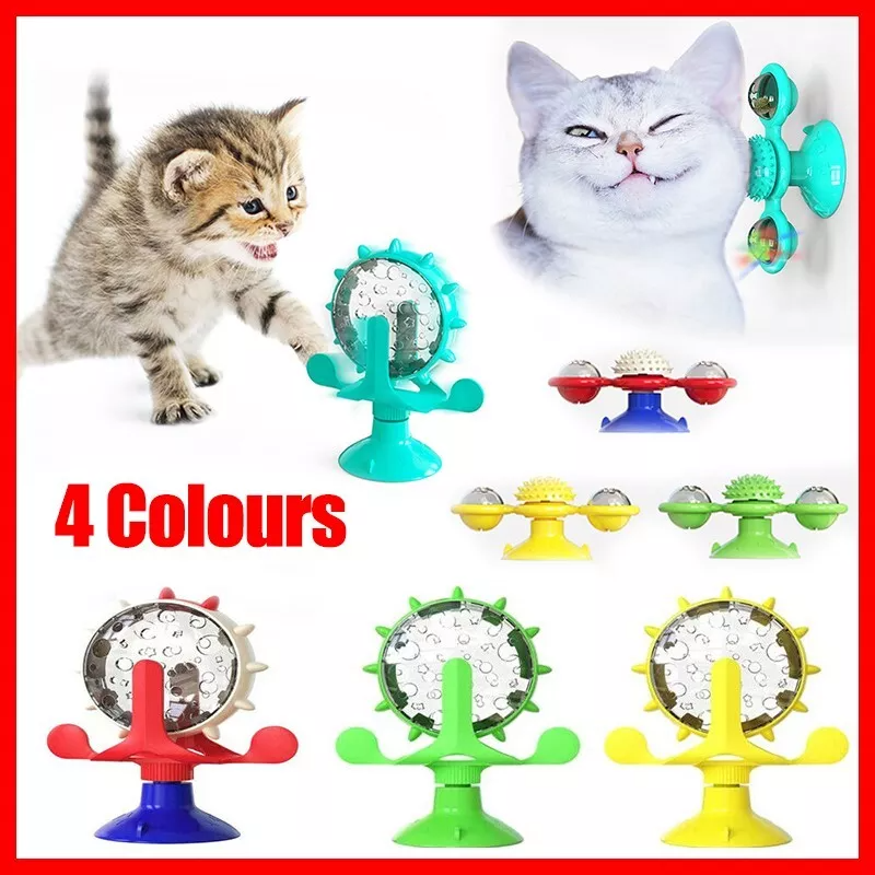 Interactive plastic windmill pet treat dispenser toy with suction cup base and food holes