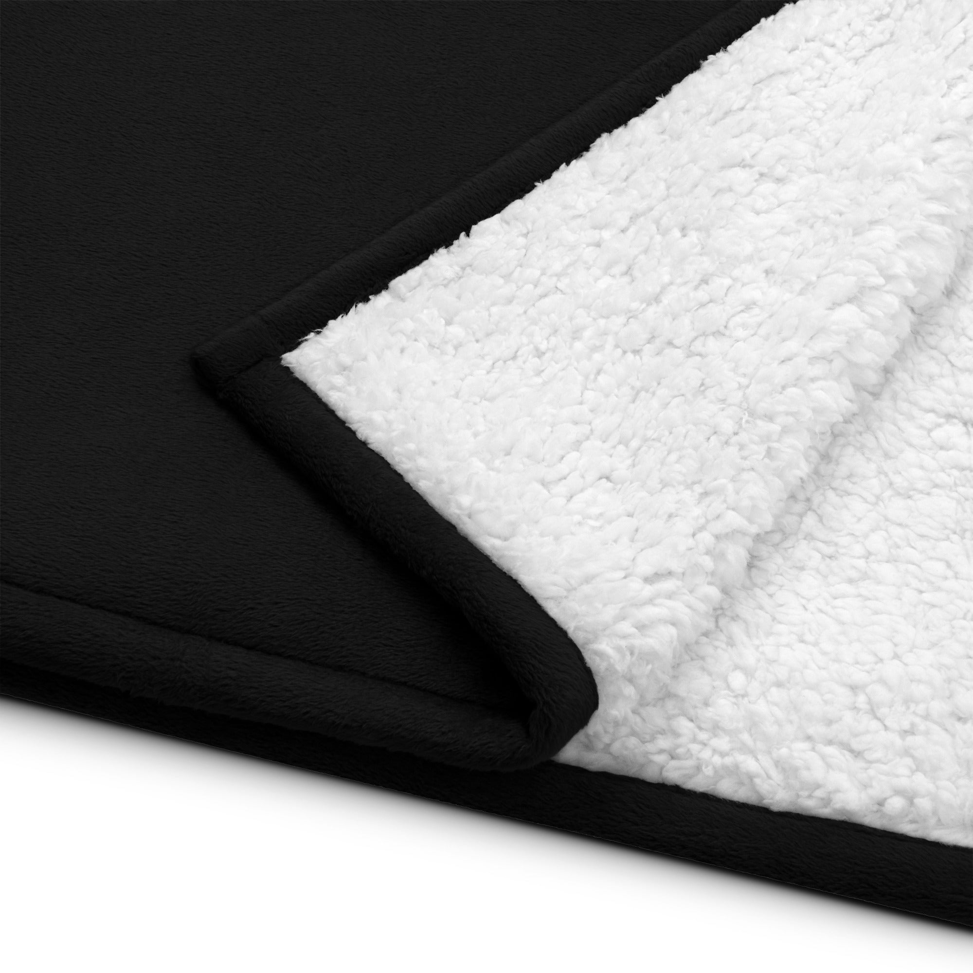 DORSAL premium sherpa blanket folded showing smooth sheeny fleece exterior and plush soft sherpa interior