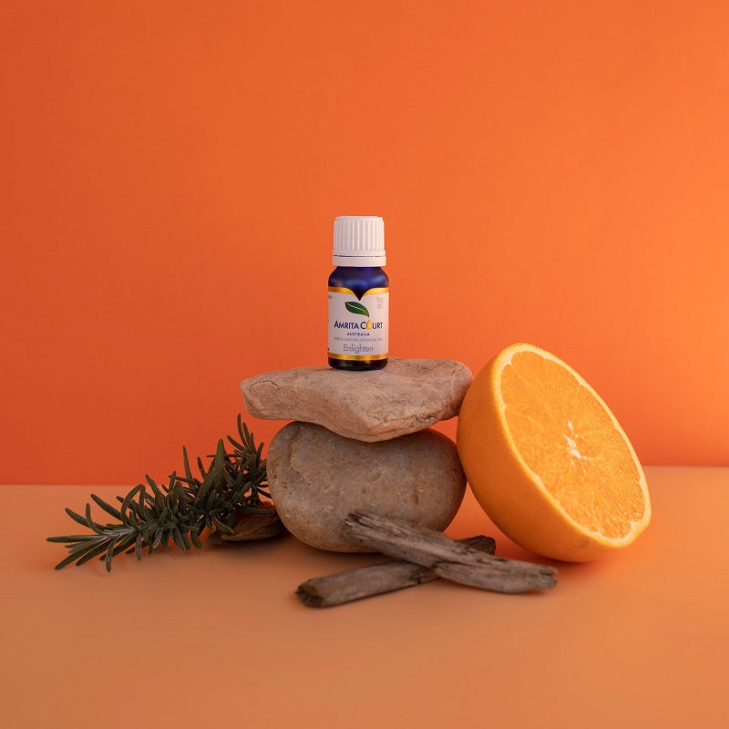 Enlighten essential oil blend in amber glass bottle with sweet citrus aromatherapy liquid — view 2