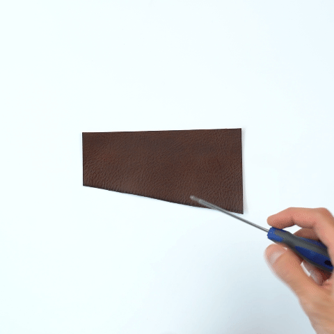 Leather AirTag bag charm attached to a metal ring, crafted from full-grain premium Italian leather — view 5