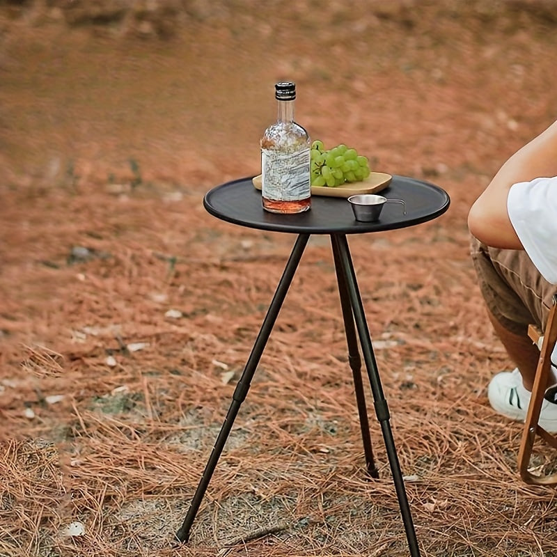 Portable round camping table with tripod base and fabric storage bag for outdoor adventures. — view 2