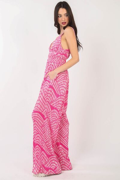 Women's printed pleated sleeveless wide leg jumpsuit in lightweight polyester with built-in side pockets — view 3