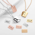 Personalized envelope necklace in gold displaying a hidden custom message pendant inside a box