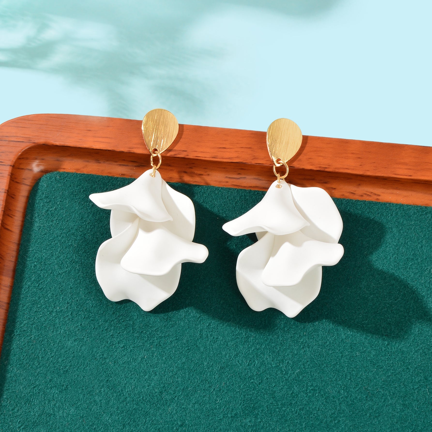 Elegant flower petal dangle earrings for women in shiny metal for daily and party wear