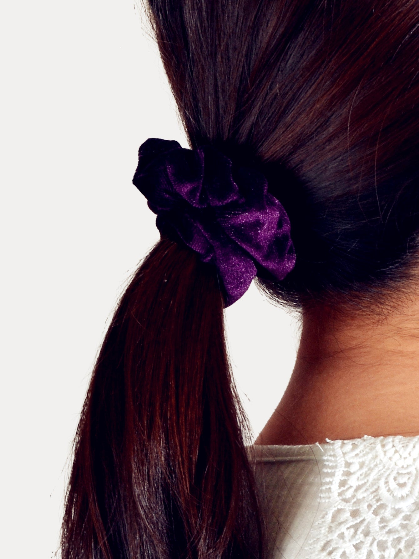 Retro velvet elastic scrunchie hair tie displaying soft fabric texture and flexible circular shape — view 3