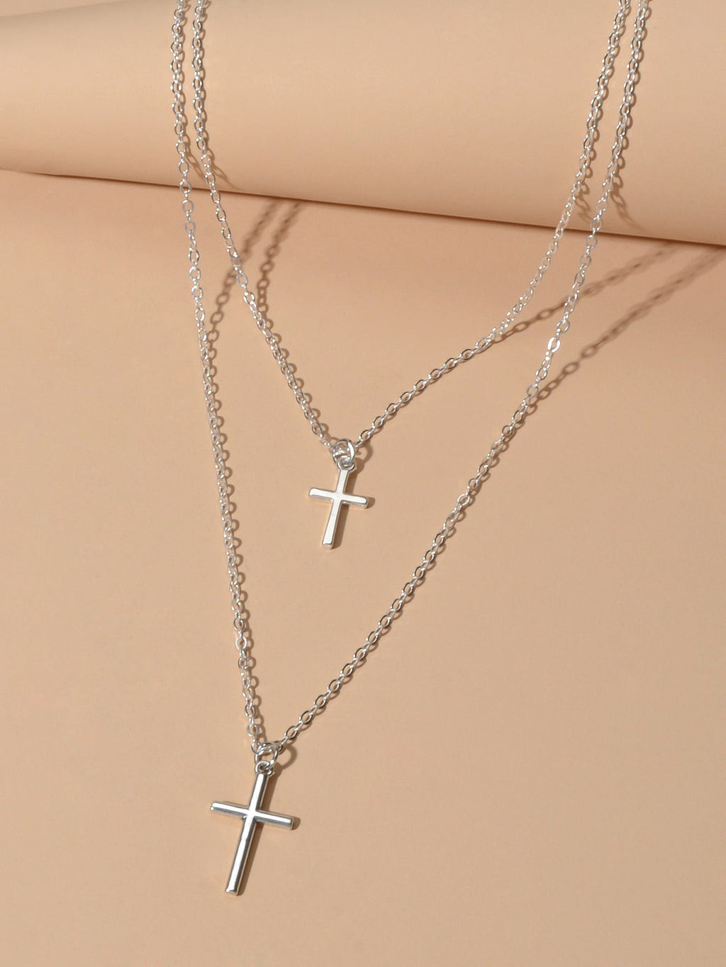 Silver double layer cross necklace featuring delicate chains and a minimalist pendant for women — view 3