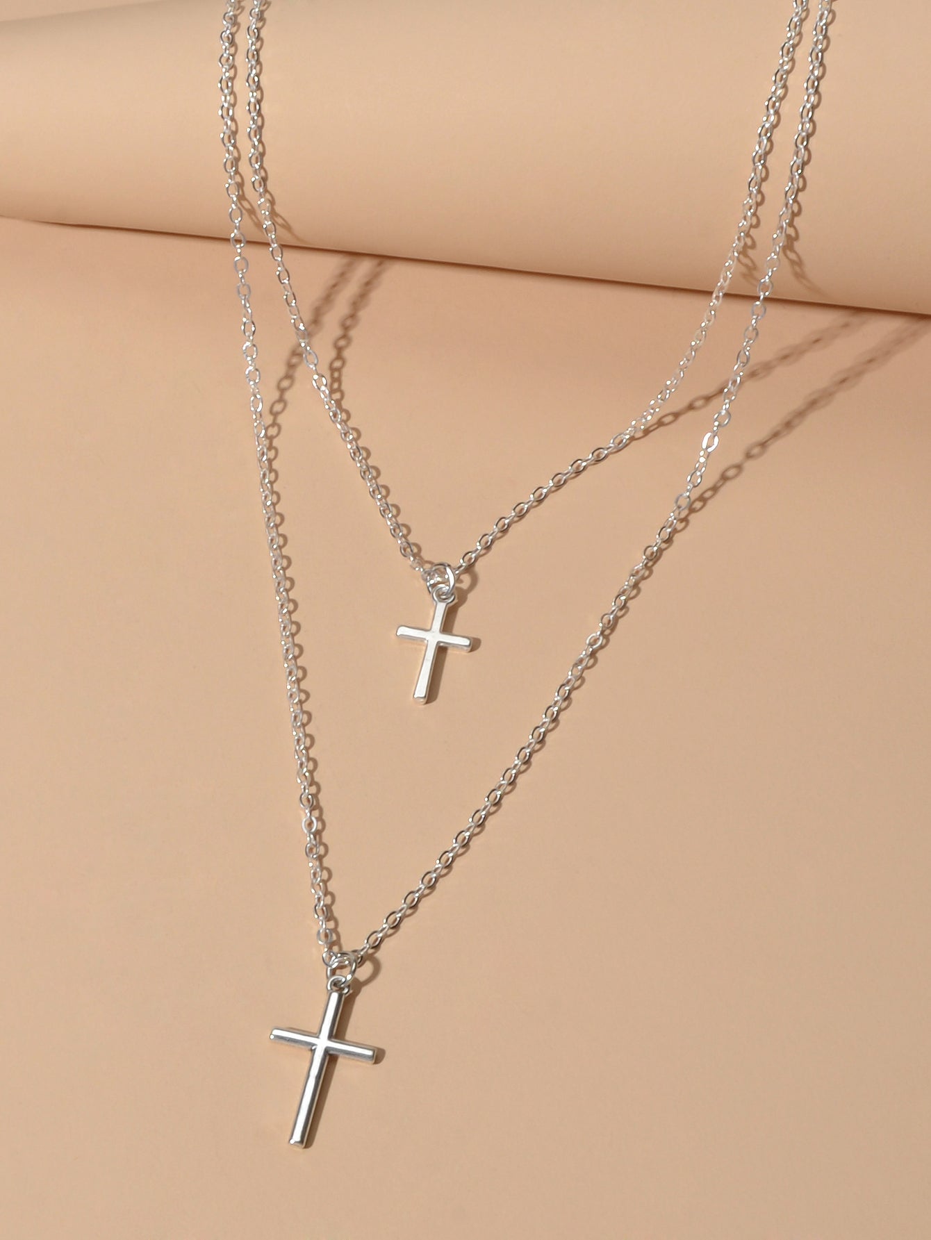 Silver double layer cross necklace featuring delicate chains and a minimalist pendant for women — view 3