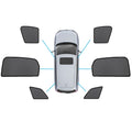 Black magnetic mesh car window sun shades installed on the front and rear of an Audi.