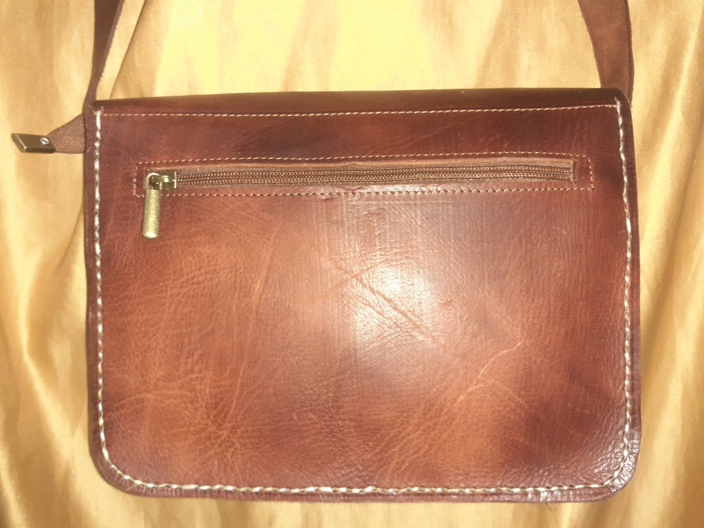 Two-tone leather crossbody bag with rustic finish, front zipper pocket, and long adjustable shoulder strap — view 13