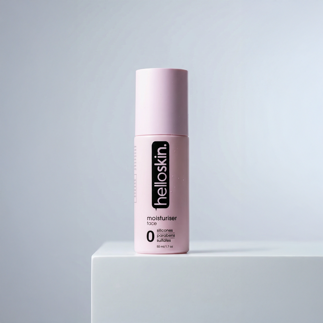 Helloskin face moisturiser cream in a minimalist jar surrounded by fresh botanical ingredients