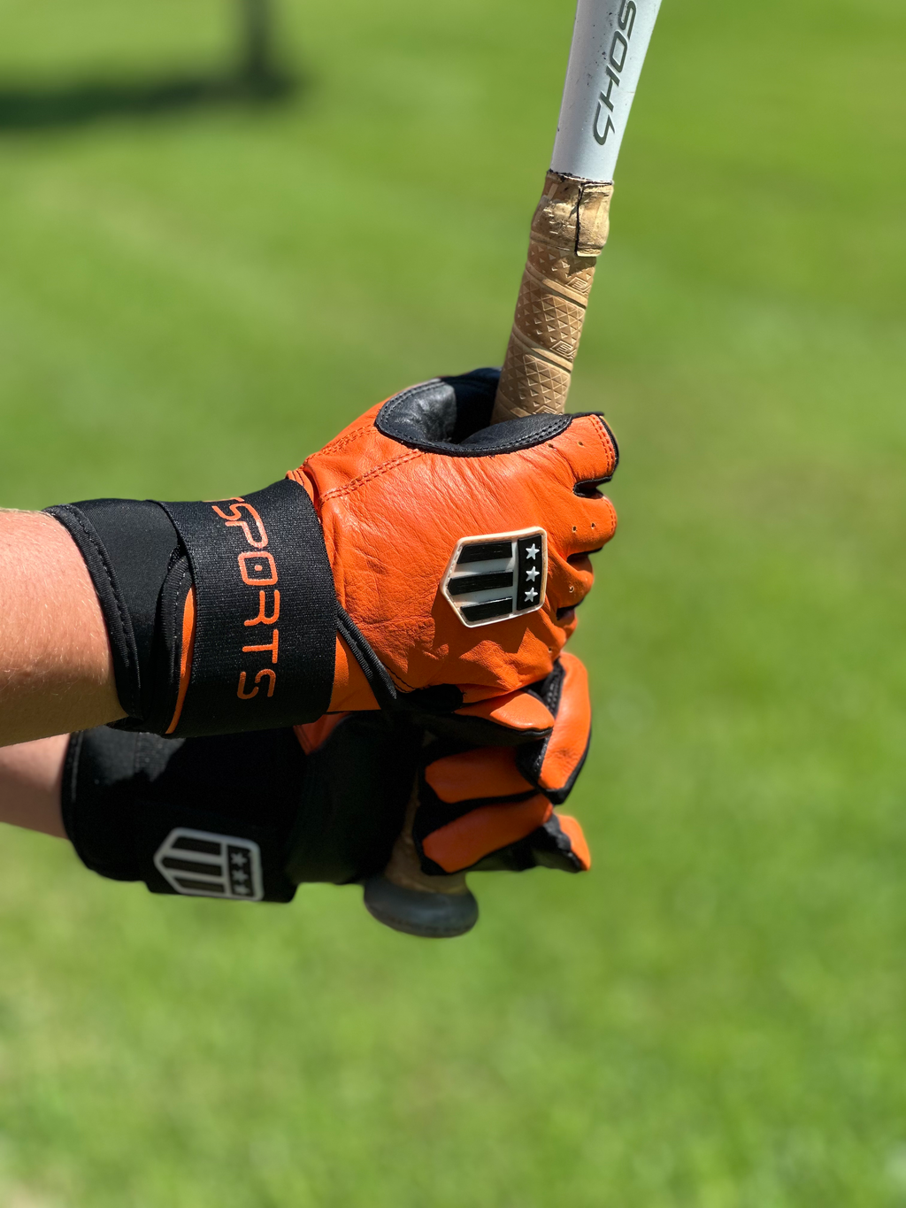 Long cuff batting glove in orange and black full leather for superior wrist support