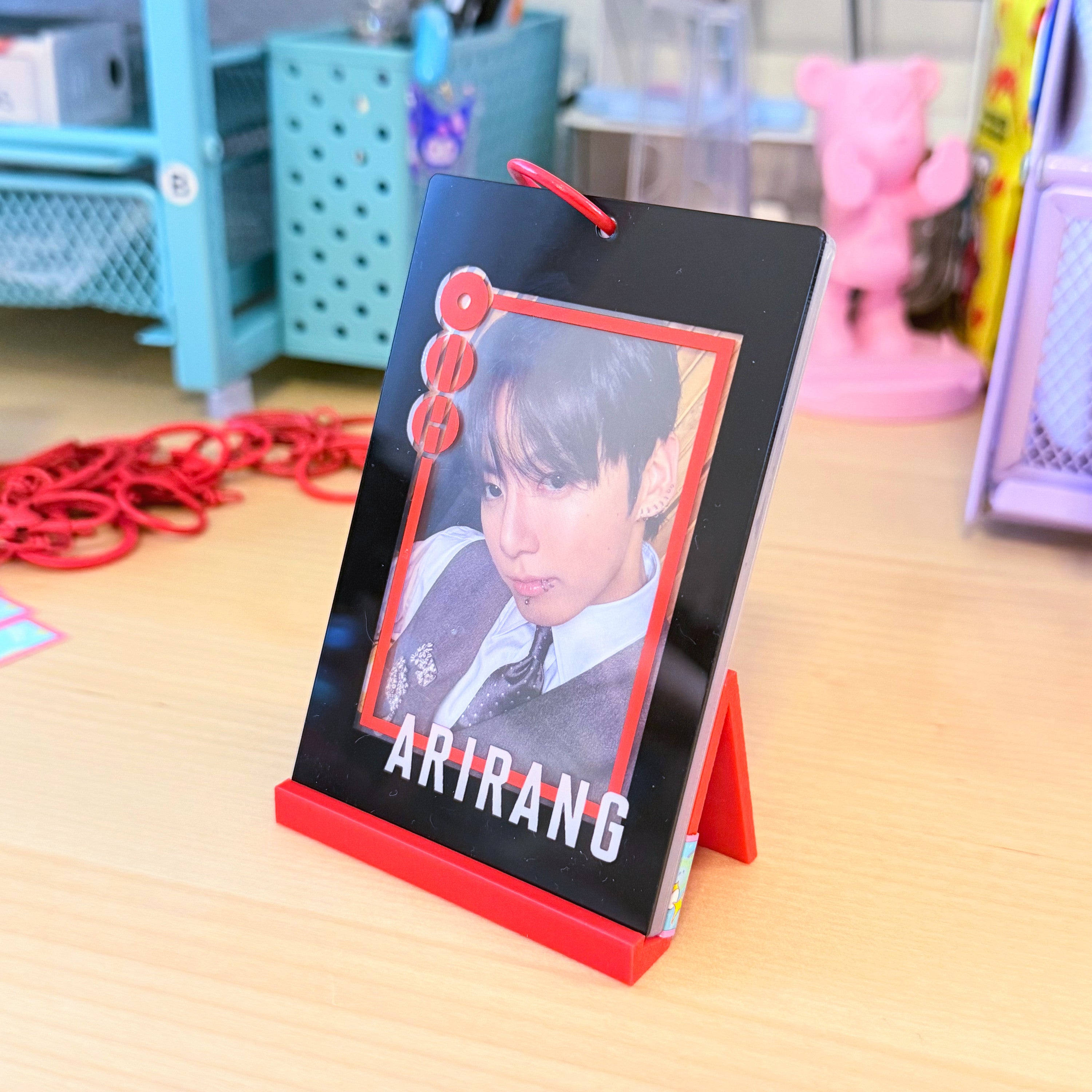 BTS Arirang acrylic photocard holder keychain with bold red frame and minimalist display layout. — view 4