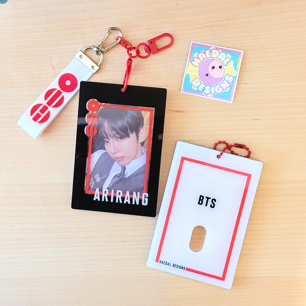 BTS Arirang acrylic photocard holder keychain with bold red frame and minimalist display layout. — view 2