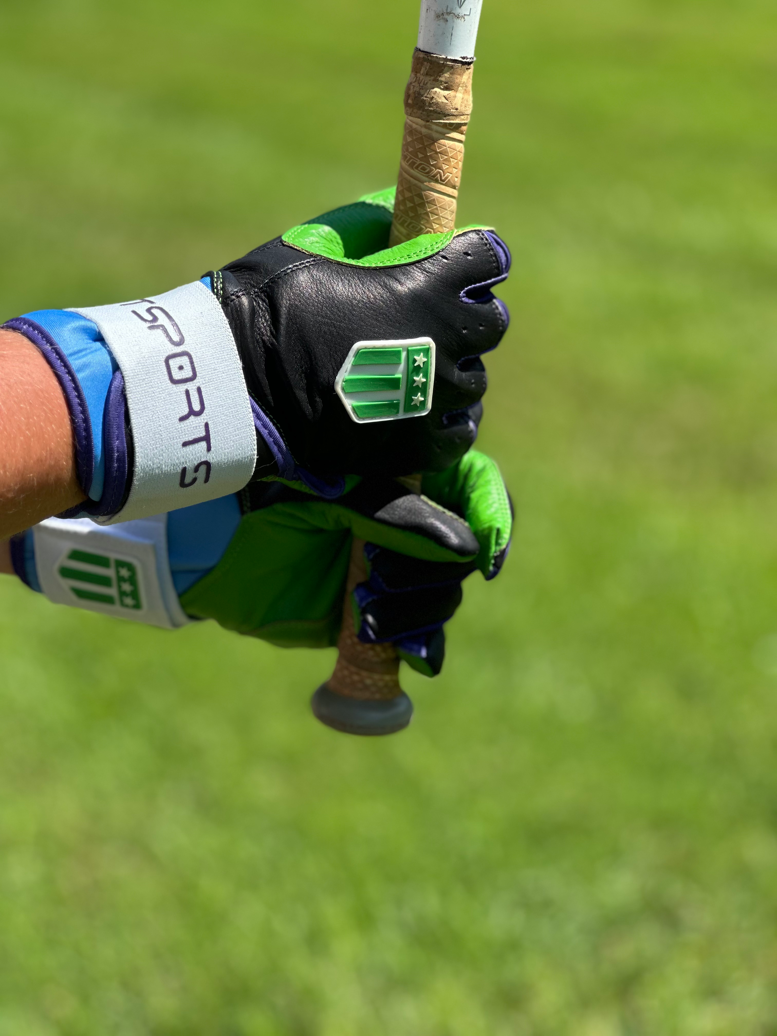 Tampa Bay long cuff batting glove in black with vibrant neon green palm and premium leather