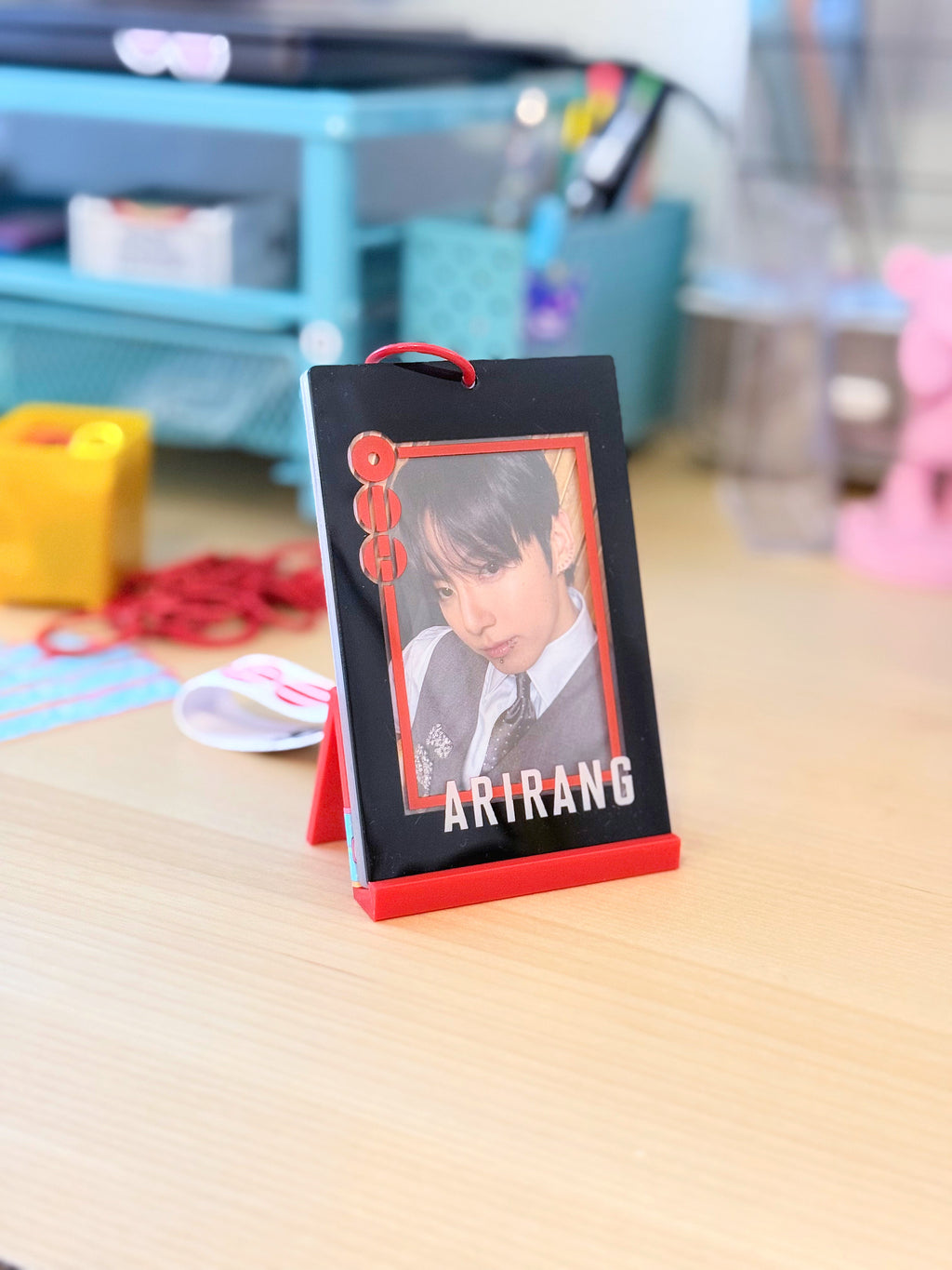 BTS Arirang acrylic photocard holder keychain with bold red frame and minimalist display layout. — view 5