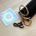 Custom Jung Kook logo charm keychain in vibrant PLA attached to a gold metal keyring