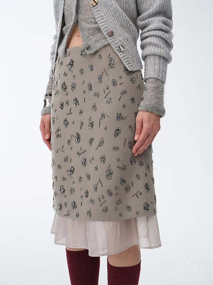 Womens asymmetrical hand-embroidered sequin floral skirt with sheer irregular hemline detailing.