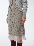 Womens asymmetrical hand-embroidered sequin floral skirt with sheer irregular hemline detailing.