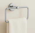 Square stainless steel towel ring with sleek silver chrome finish mounted on modern bathroom wall.