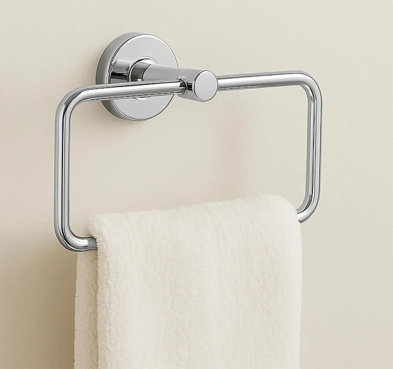 Square stainless steel towel ring with sleek silver chrome finish mounted on modern bathroom wall.