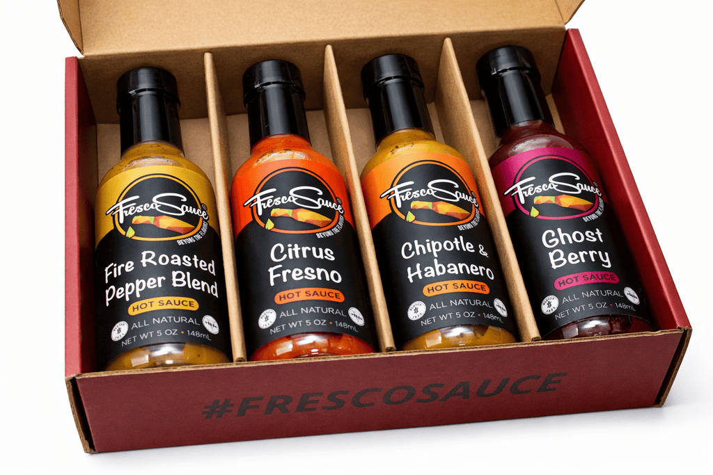 Custom 4-pack gourmet hot sauce gift box displaying four glass artisan bottles inside. — view 3