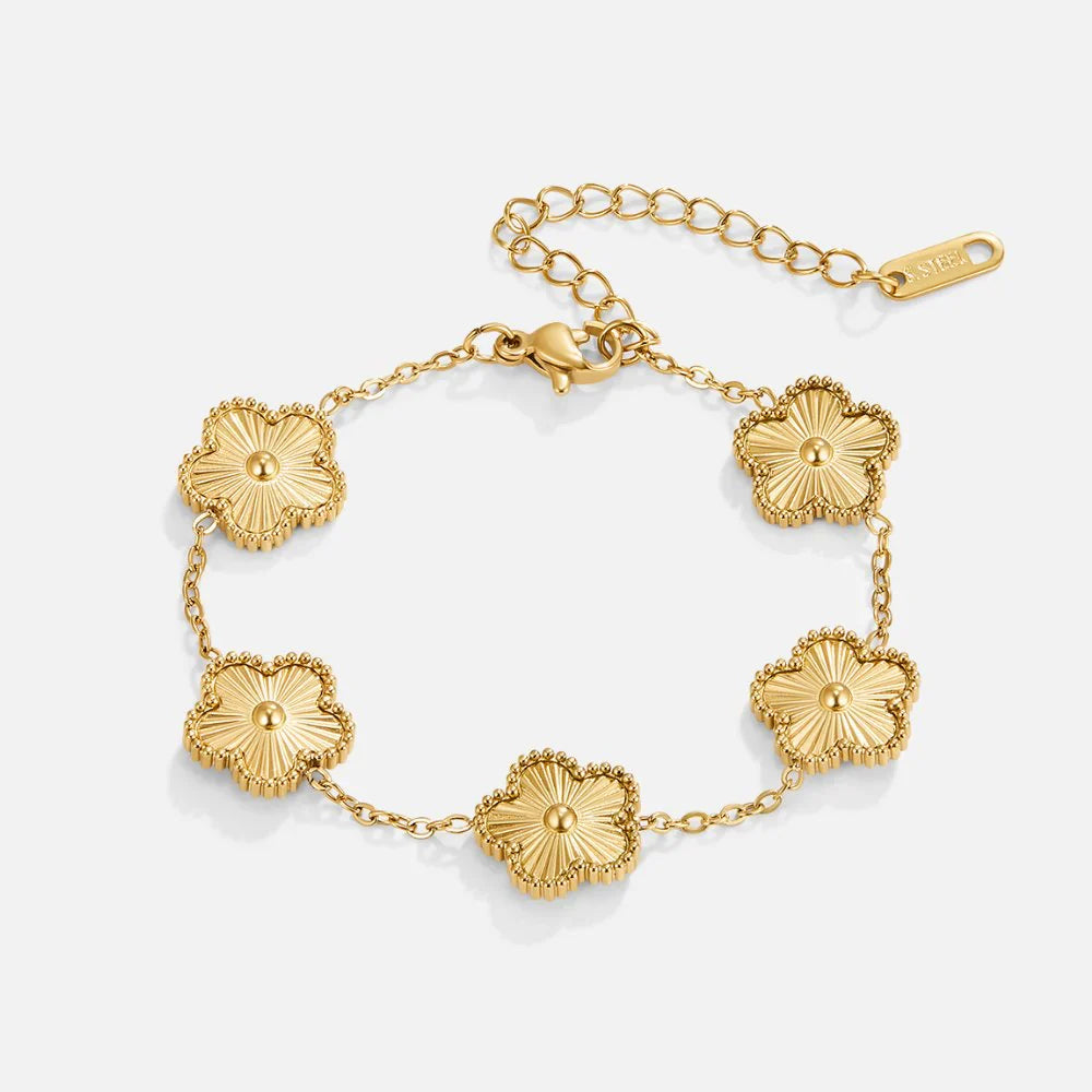 Golden clover flower charm bracelet with a radiant gold finish and delicate adjustable chain