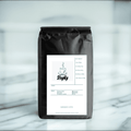 Premium French Vanilla whole bean coffee with rich brown medium roasted beans and natural flavoring
