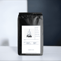 Colombia Specialty medium roast whole bean coffee bag featuring premium artisan espresso beans
