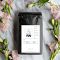 Bag of blonde espresso whole bean coffee featuring a light roast profile for home baristas