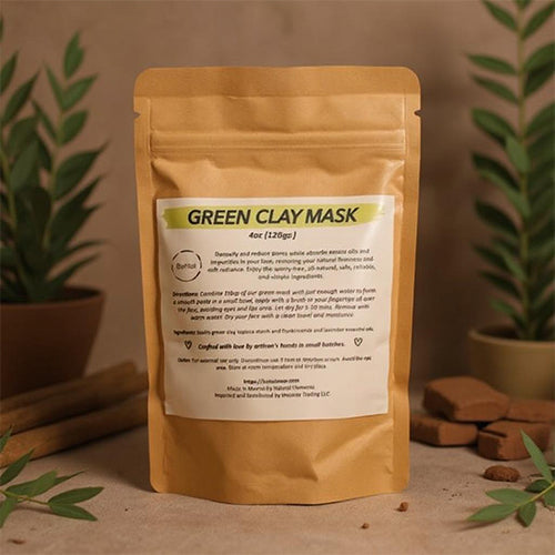 All-natural green clay facial mask powder packaged in an eco-friendly kraft paper bag.