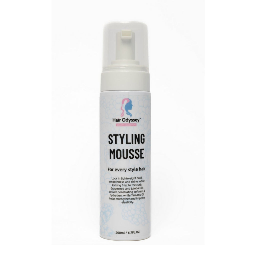 Hair Odyssey styling mousse dispenser bottle showcasing lightweight strong hold formula with botanical oils