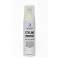 Hair Odyssey styling mousse dispenser bottle showcasing lightweight strong hold formula with botanical oils