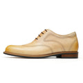 Hand-finished beige calfskin leather wingtip oxford dress shoes for men with detailed perforations