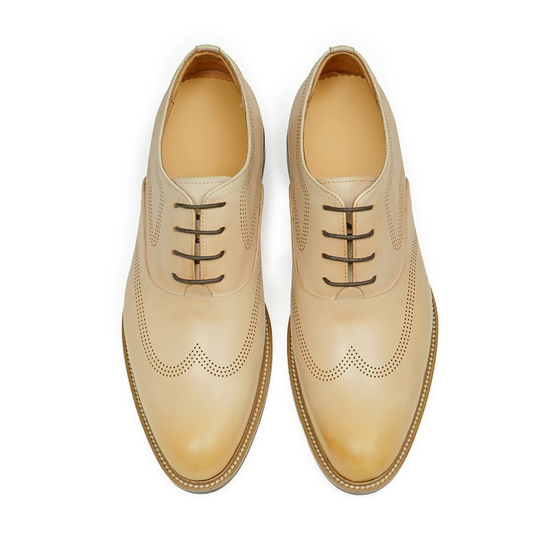 Hand-finished beige calfskin leather wingtip oxford dress shoes for men with detailed perforations — view 4