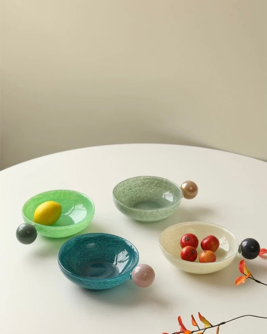 Whimsical handblown glass salad bowl with tropical fruit inspired design functioning as eclectic home decor
