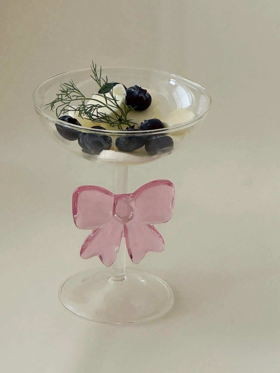 Handmade cocktail coupe set of two with delicate pink glass bows attached to the clear stems — view 2