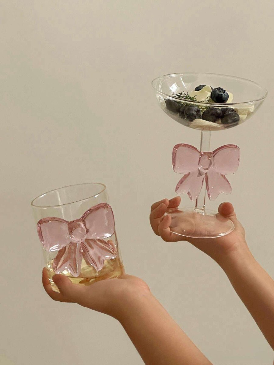 Handmade cocktail coupe set of two with delicate pink glass bows attached to the clear stems — view 3