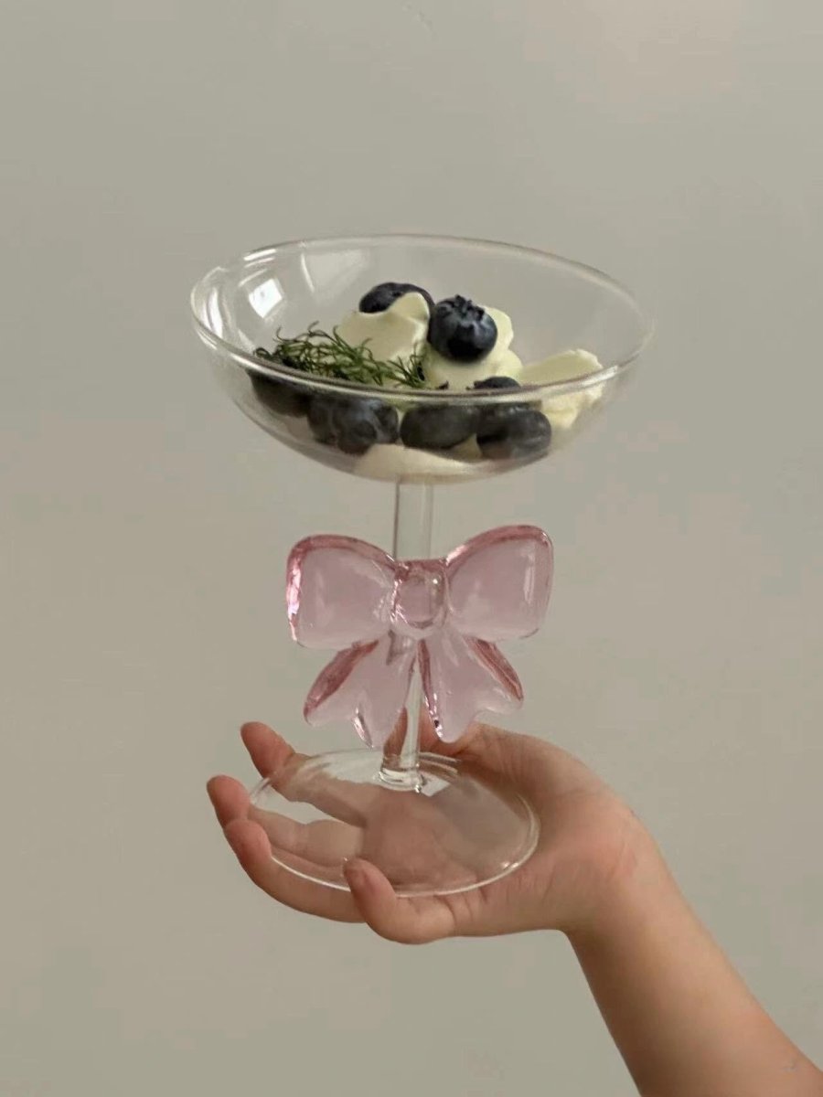 Handmade cocktail coupe set of two with delicate pink glass bows attached to the clear stems
