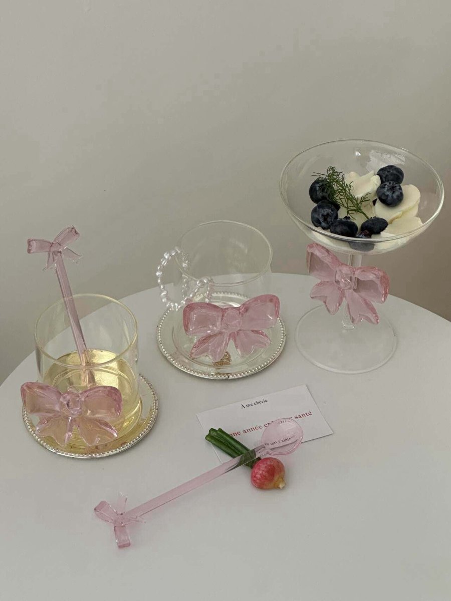 Handmade cocktail coupe set of two with delicate pink glass bows attached to the clear stems — view 5
