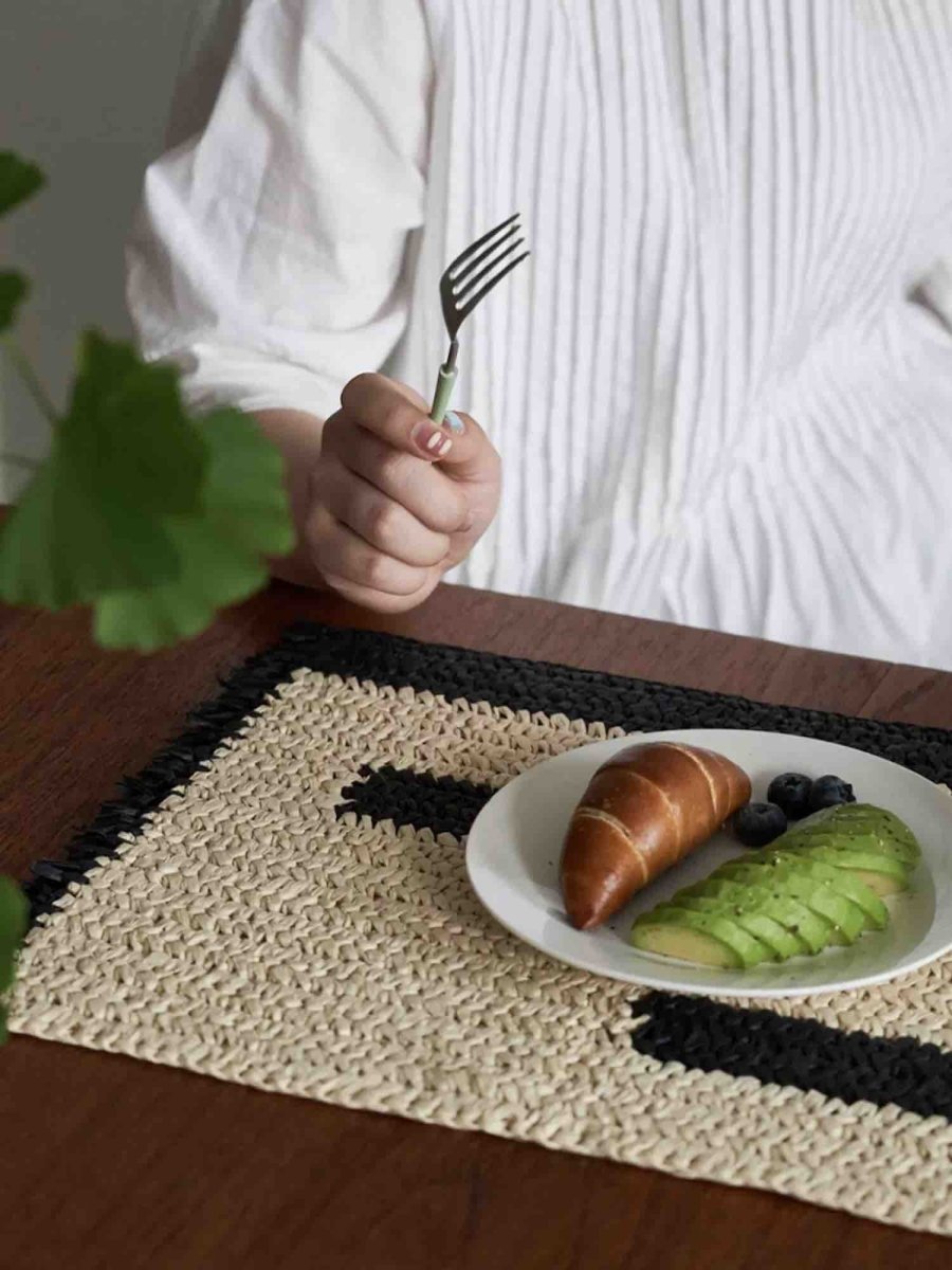 Retro handwoven natural reed placemat set of four on an elegantly styled Nordic dining table — view 2