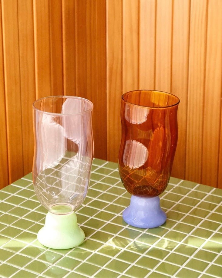 Handmade wavy beer glass in clear borosilicate glass filled with a golden craft beverage — view 4