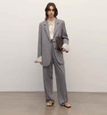 Women's classic two-button loose straight wool blazer featuring an asymmetrical collar design.